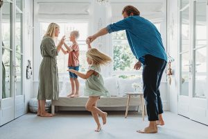 children playing in home during Guildford family photoshoot