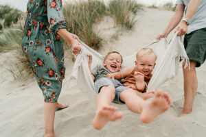 smiling children during beach shoot in West wittering