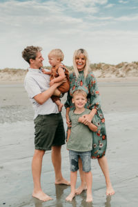sun family at west wittering beach by photographer hester barnes