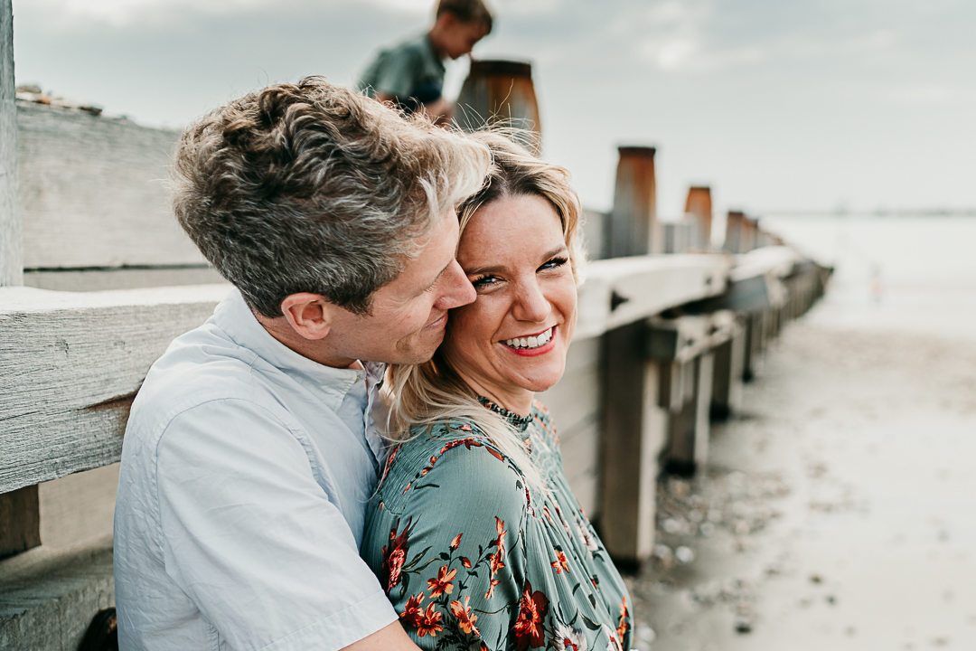 couple on west wittering beach during family photoshoot